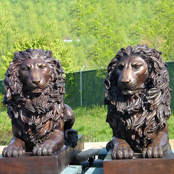 Bronze wild lion sculpture with ball