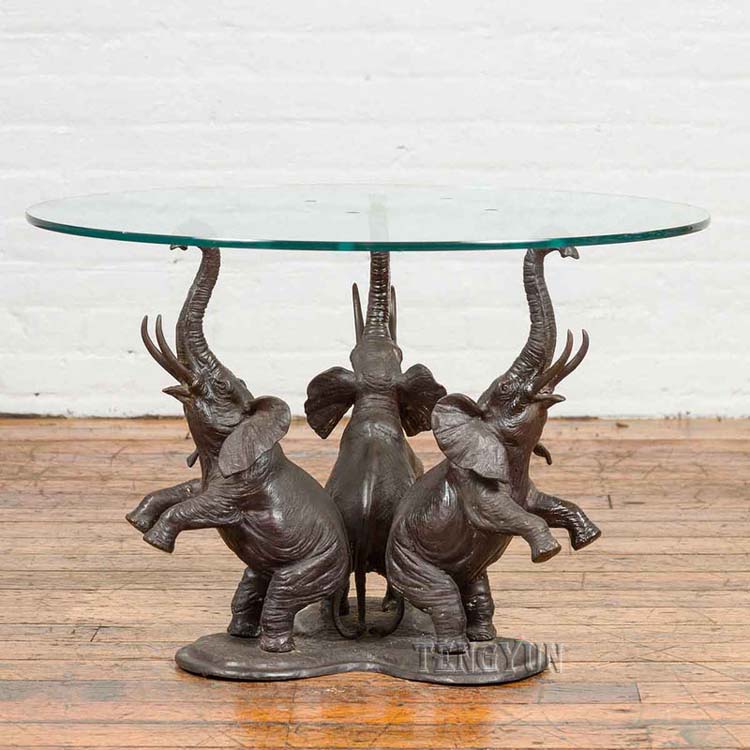https://www.firststatue.com/sculpture-end-table-three-bronze-small-elephant-sculptures-legs-home-metal-coffee-table-product/