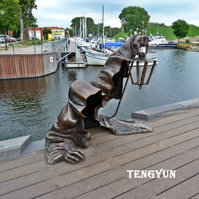 https://www.firststatue.com/famous-antique-juodasis-abstract-metal-bronze-ghost-statue-with-lamp-for-pond-decoration-product/