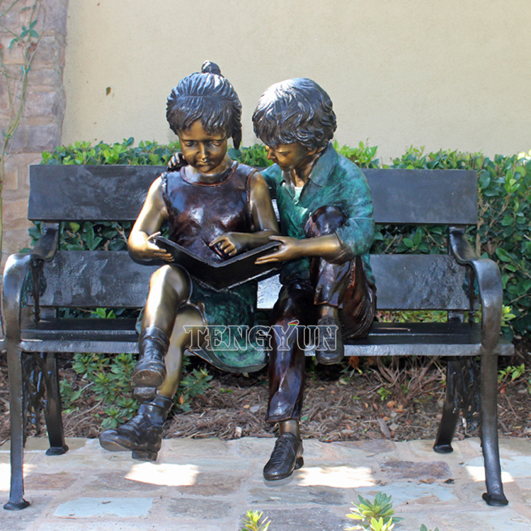 Boy and girl reading book on bench bronze sculptures (2)