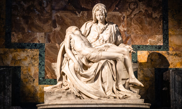Vatican, Rome, Italy - December 9, 2018: La Pieta ("The Pity") 1499 Renaissance sculpture by Michelangelo Buonarroti, inside St. Peter's Basilica.