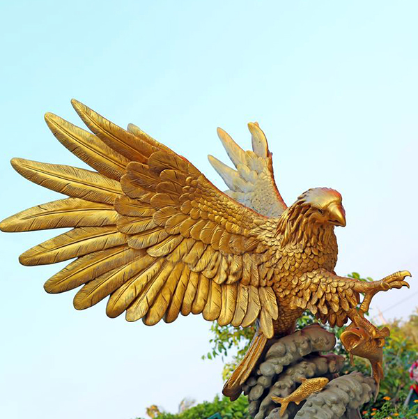 golden bronze flying eagle sculpture