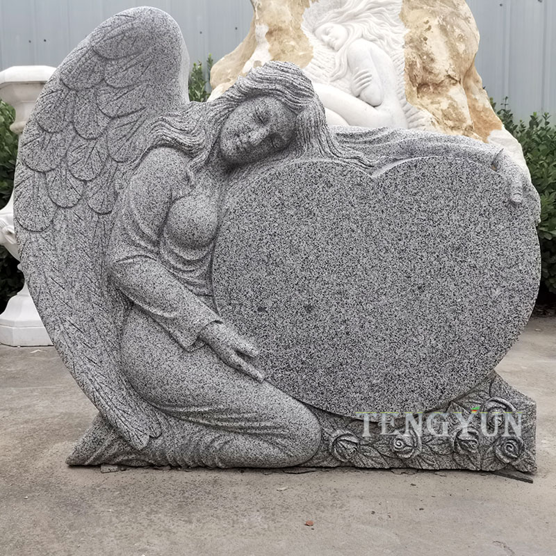 granite angel tombstone with heart