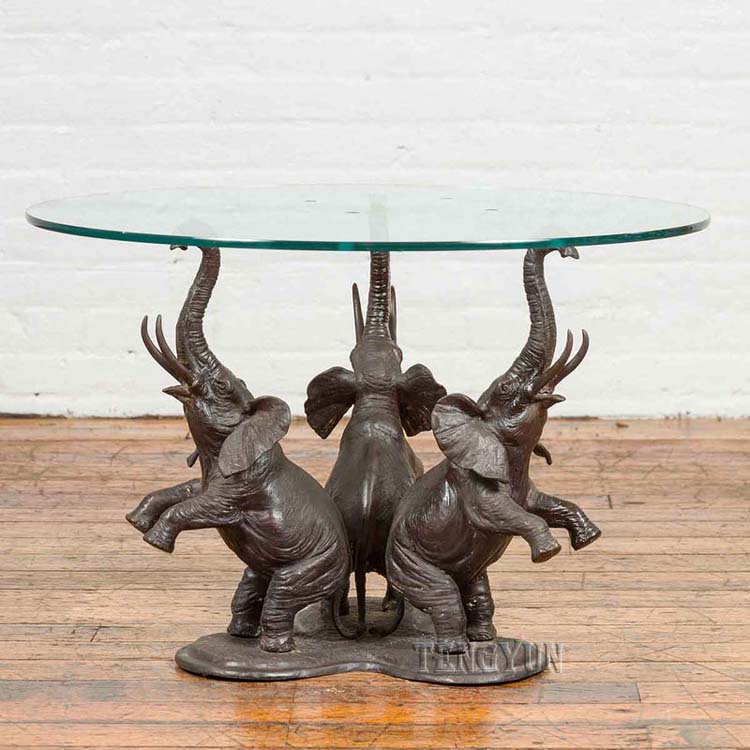 three elephant sculpture coffee table