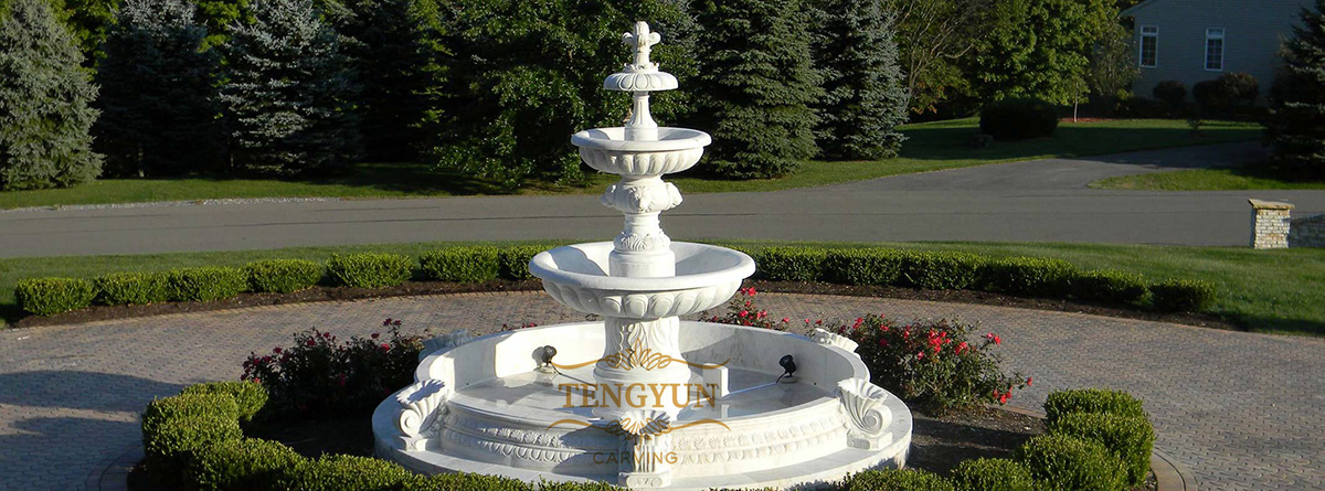 white marble carved tiered fountain